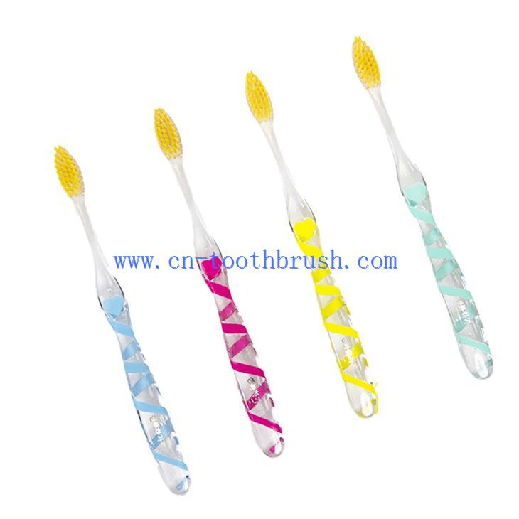 Brosse à dents à poils dorés avec manche en cristal